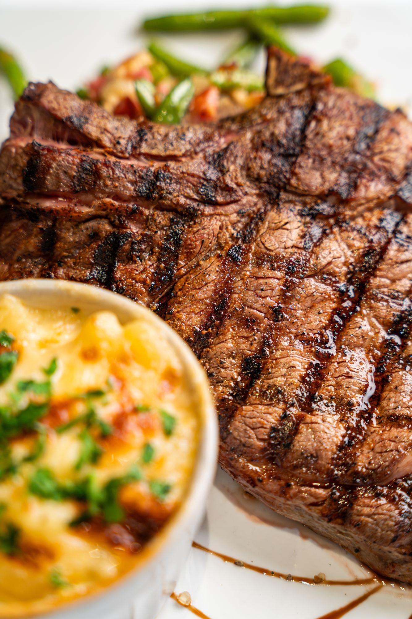 Steak with mac and cheese and sides